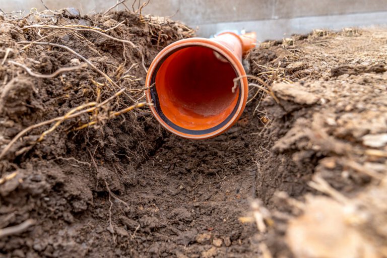 plastic pvc waste sewer pipe in the ground. construction site